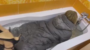 Miss Viki bathes in her winter clothes