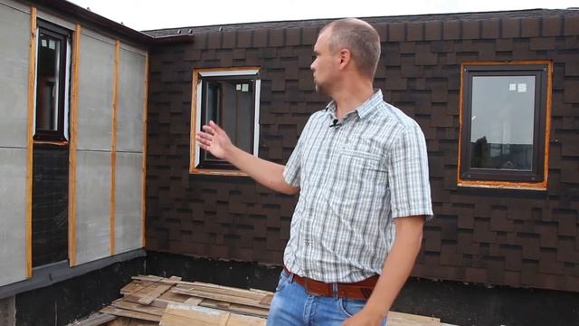 Конструкция кровли из мягкой черепицы с заходом на стену дома