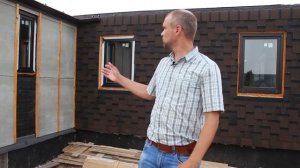 Конструкция кровли из мягкой черепицы с заходом на стену дома