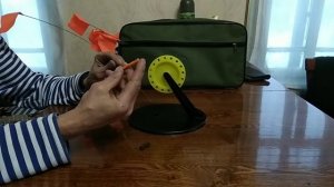 Фиксатор флажка для жерлицы.