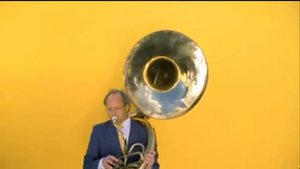 Bert Brandsma playing sousaphone in a TV Commercial