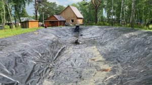 Пруд для разведения рыбы после года эксплуатации