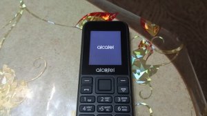 Мобильный телефон alcatel 1068D: Низкий заряд батареи. Выключение