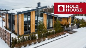 Дом из клееного бруса, производства компании Holz House. Вертикальное расположение бруса.