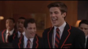Grant Gustin sings in glee.