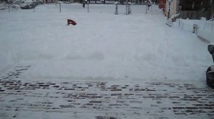 Husqvarna ST121E Snow Blower Cleaning a Patio