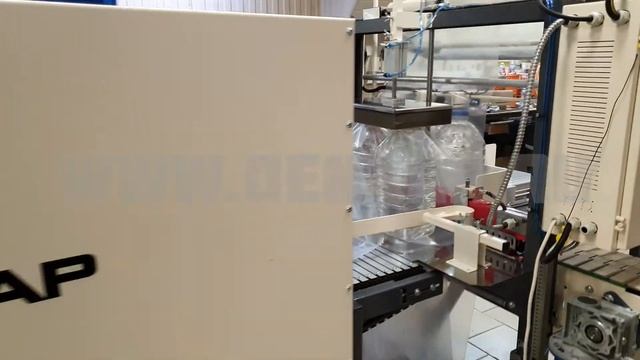 Групповая термоупаковка пэт 5 литров. Термоупаковочная ТМ-1А машина с поворотным транспортёром. смотреть онлайн