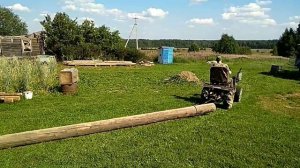 Таскаем брёвна минитрактором