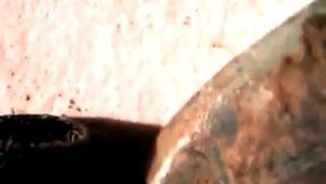 Видео с микроскопа чистка античных монеты шаберами обол Ольвии