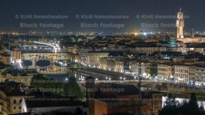 Famous Arnolfo tower of Palazzo Vecchio timelapse and Arno River at night in Florence, Tuscany