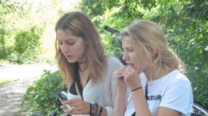 2 smoking girls in a park