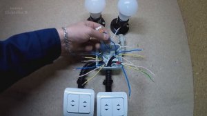 Схема подключения двухклавишного проходного выключателя.