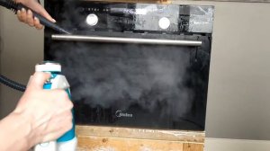 Чистка поверхности духовки и варочной панели от масляных пятен с пароочистителем КТ-918-3 Kitfort.
