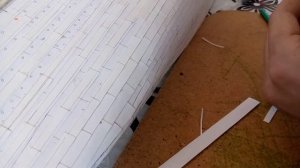 Британник. Чистовая обшивка и иллюминаторы. Моделька растет.