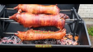 Жареный поросенок на вертеле. Grilēta cūka, cūka uz iesma. Hog Roast pork