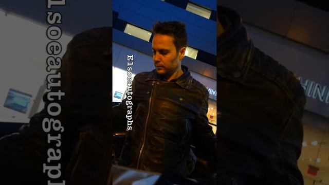 Taylor Kitsch signing autographs while promoting Waco