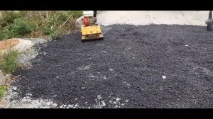 Асфальт трамбовкой