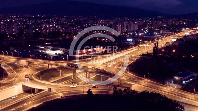Illuminated City And Interchange Overpass At Night Aerial Drone Highway Traffic Freeway Flyover смотреть онлайн