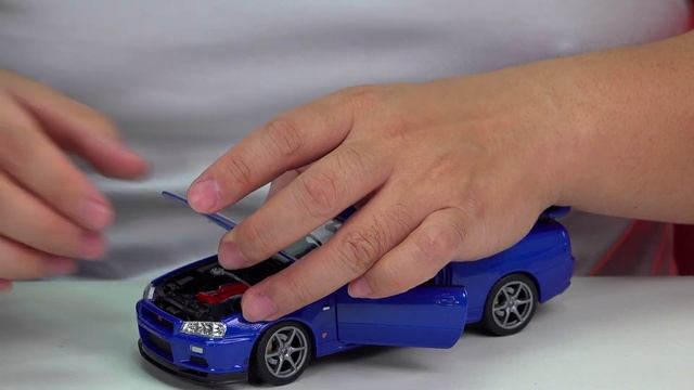 Unboxing a 1:24 Welly Nissan Skyline GTR R34 Alloy Diecast Toy Car смотреть онлайн