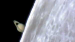 Saturn behind moon through telescope ? Timelapse.