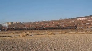 Coal mining district Jixi: steam locomotive SY0407 pushes a train coming from Liujing. DCN001916