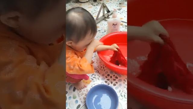 Cute baby is washing her clothes #funnybabyvideos #cutebaby #baby