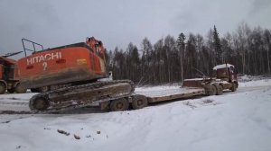 заезд экскаватора Hitachi 470 на трал