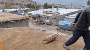 Mohammad takes care of the sheep on a rainy day and cooks a buttermilk soup with her family