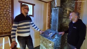 Каркасная баня 6.5х5.5 метров на сваях с чугунной печью GFS ЗК25 в облицовке из змеевика