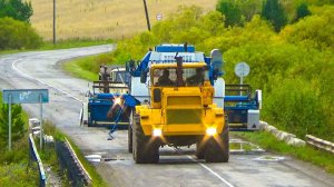 Эвакуация комбайна Енисей-950 с поля Кировцем К-701 на жесткой сцепке.