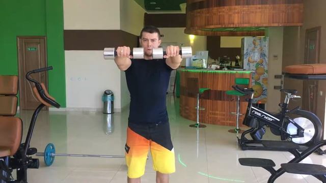 Махи гантелей перед собой.