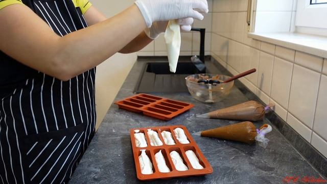 Глазированные сырки из молочных продуктов покрытые шоколадной глазурью/Quarkriegel in Schokoglasur