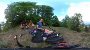 Didgeridoo with Djembe and sticks on hill top