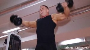 Махи гантелями в стороны стоя