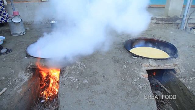National spring dish Sumalak, which is boiled 24 hours, in two big pots
