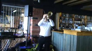 Viktor Malinovskiy blows trumpet