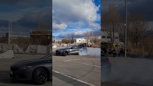 BMW M8 competition doing  burnout and donuts