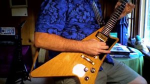 PhilFeedback Jamming out on a Gibson Moderne' Guitar.