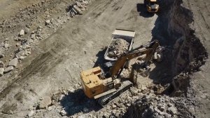 Cat 374F L loading Cat  773E - Drone video