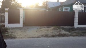 Откатные ворота пролетом 6,5 м.  Видеодомофон.