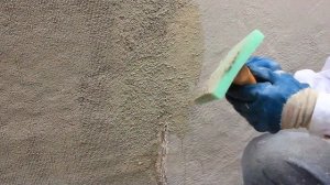 Blending new stucco into existing stucco sand finish.