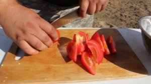 Томленая свинина с овощами в казане на костре