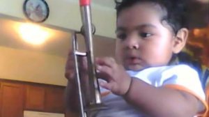 1yr old playing a mini trombone :)