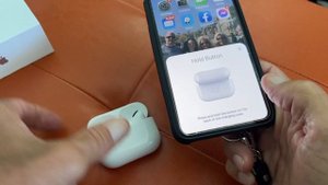 What does the button on the back of my AirPods Pro case do?