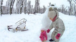 Amelia in the park with Baby Born with a snow bunny