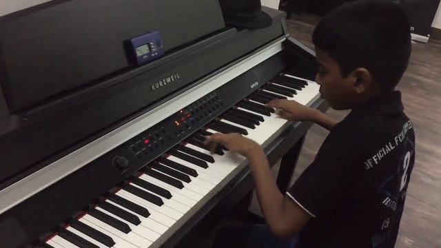 Lydian Nadhaswaram plays bumble bee when checking a new digital piano in a music shop смотреть онлайн