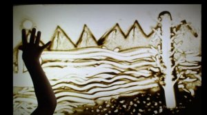 Песочная анимация на тему горно-морского пейзажа.