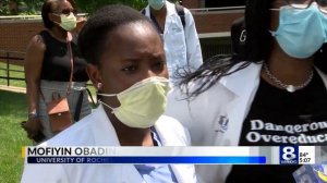 Staff at University of Rochester Medical Center kneel in silent reflection