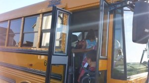 Dane & Julia board the bus for kindergarten