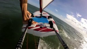 Windsurfing Foil jump. Прыжок на виндсерфинге с фойлом.